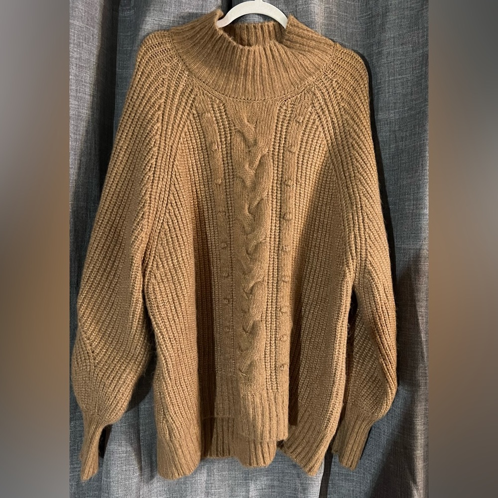 Camel color sweater. Never worn.